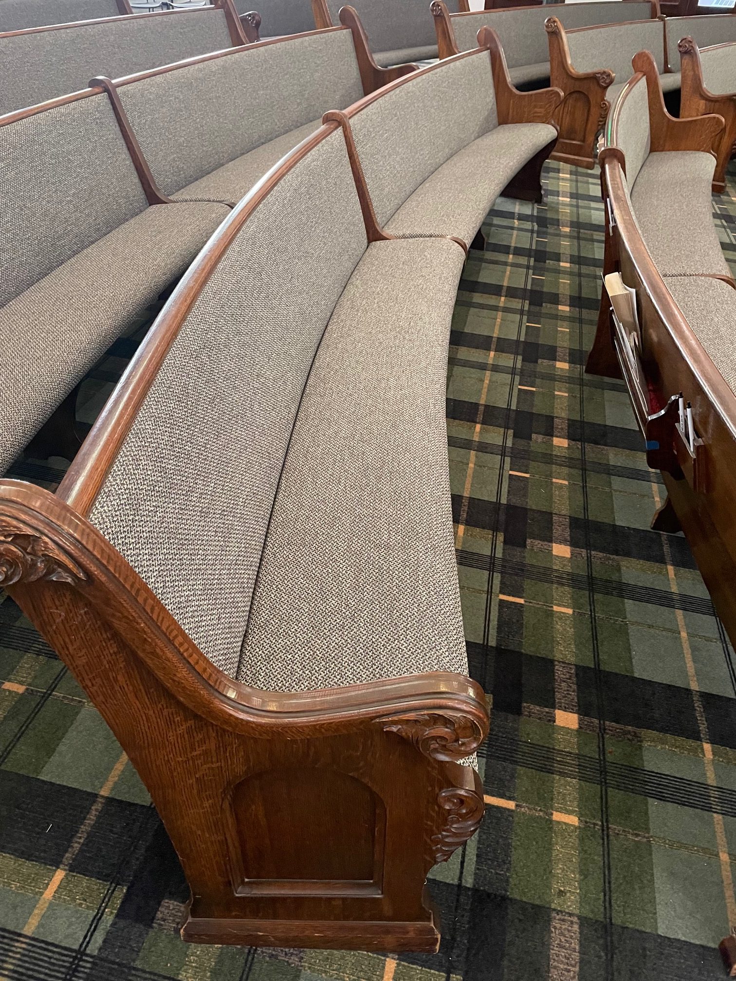 Close up of radius pew upholstery job by Woods Church Interiors in Boise, Idaho