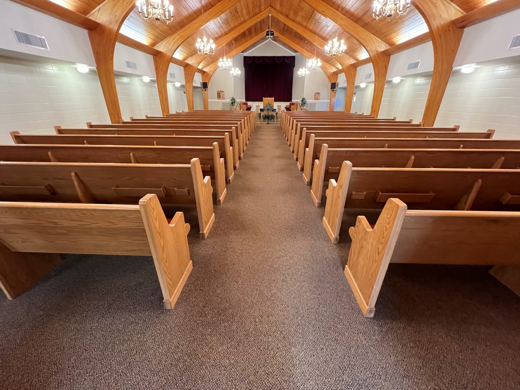 rear center aisle view of new Kivetts pews from Woods Church Interiors installed in Woodbury, Tennessee