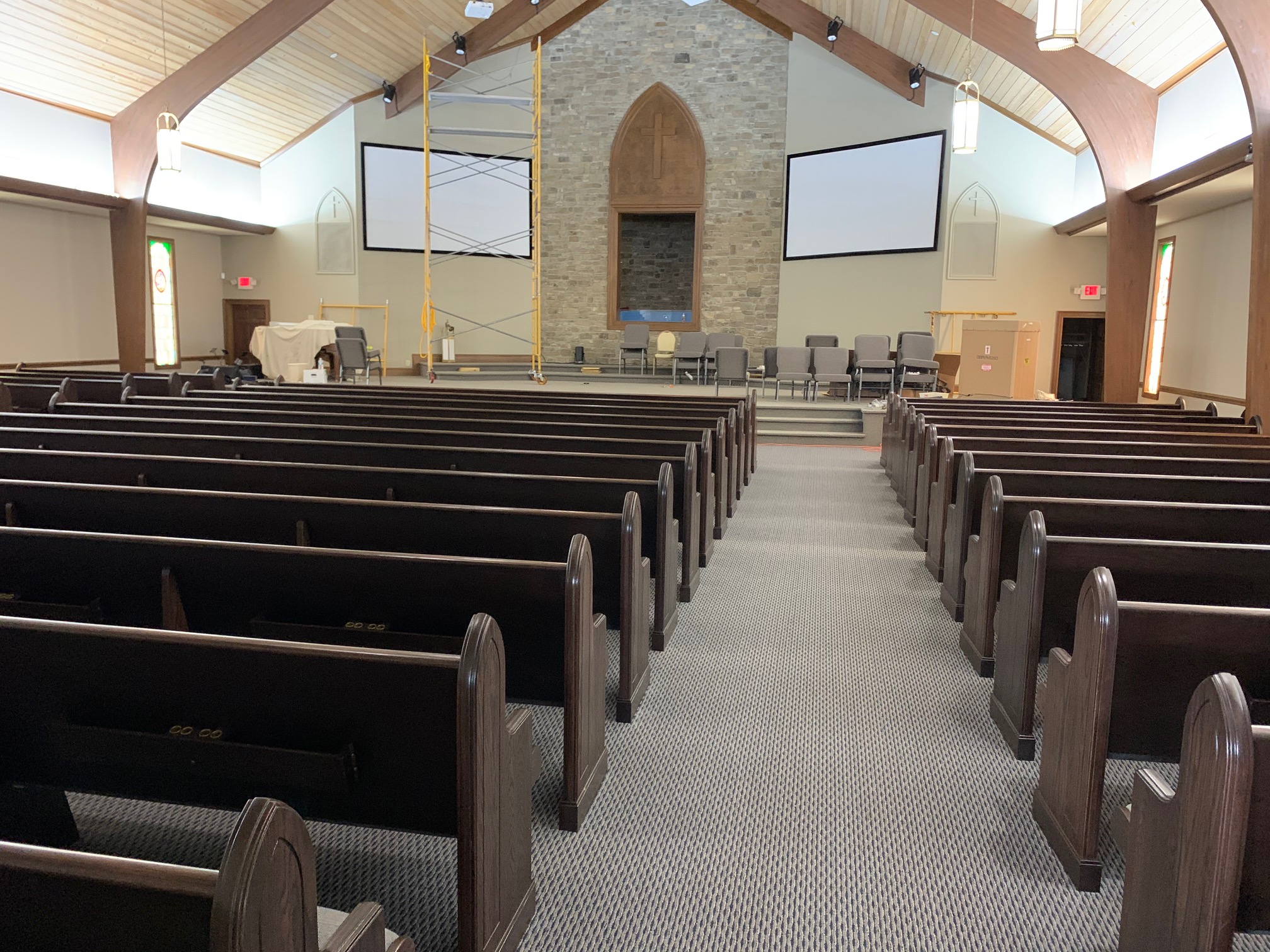 Side aisle rear view of New Kivetts Church Pews from Woods Church Interiors in Macon, Georgia